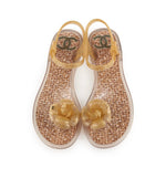 Load image into Gallery viewer, Chanel Gold glitter jelly Camellia ankle strap thong flat sandals
