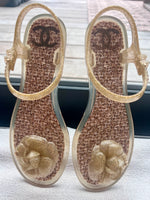 Load image into Gallery viewer, Chanel Gold glitter jelly Camellia ankle strap thong flat sandals
